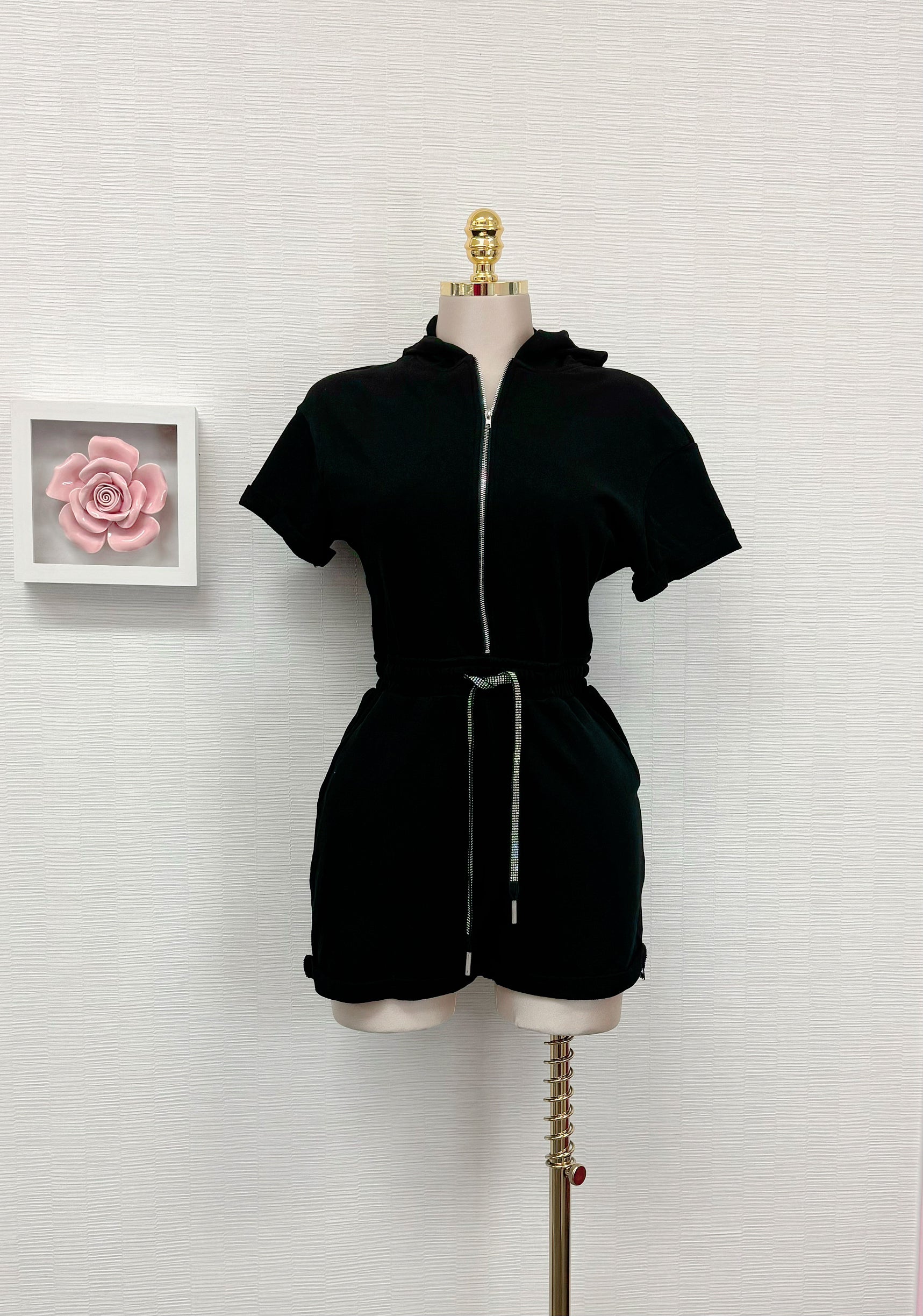 Black Zip-Front Hooded Romper.